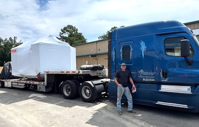 Gary Wentzel with that Freightliner and one among many loads he's hauled for Oberman.