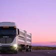 Nikola electric semi-truck on highway at sunset with purple sky
