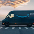 Rivian-built Amazon Prime delivery van parked at sunrise with dramatic cloudy sky