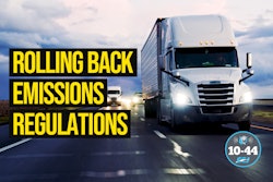 White semi-truck driving on highway with emissions regulations text overlay
