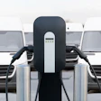 Electric vehicle charging station with two charging points and white vehicles
