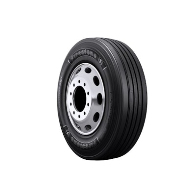 Firestone truck tire with silver wheel rim on white background