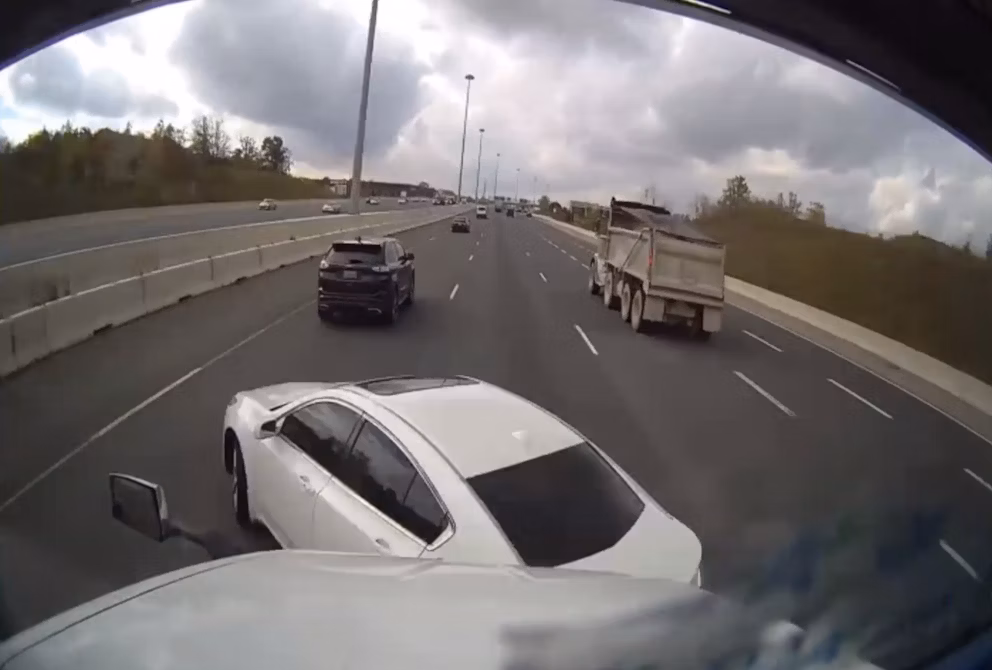 Idelic dash camera captures video of car cutting off truck driver.