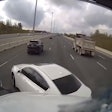 Idelic dash camera captures video of car cutting off truck driver.