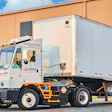 White Lazer Logistics electric truck trailer at warehouse loading dock