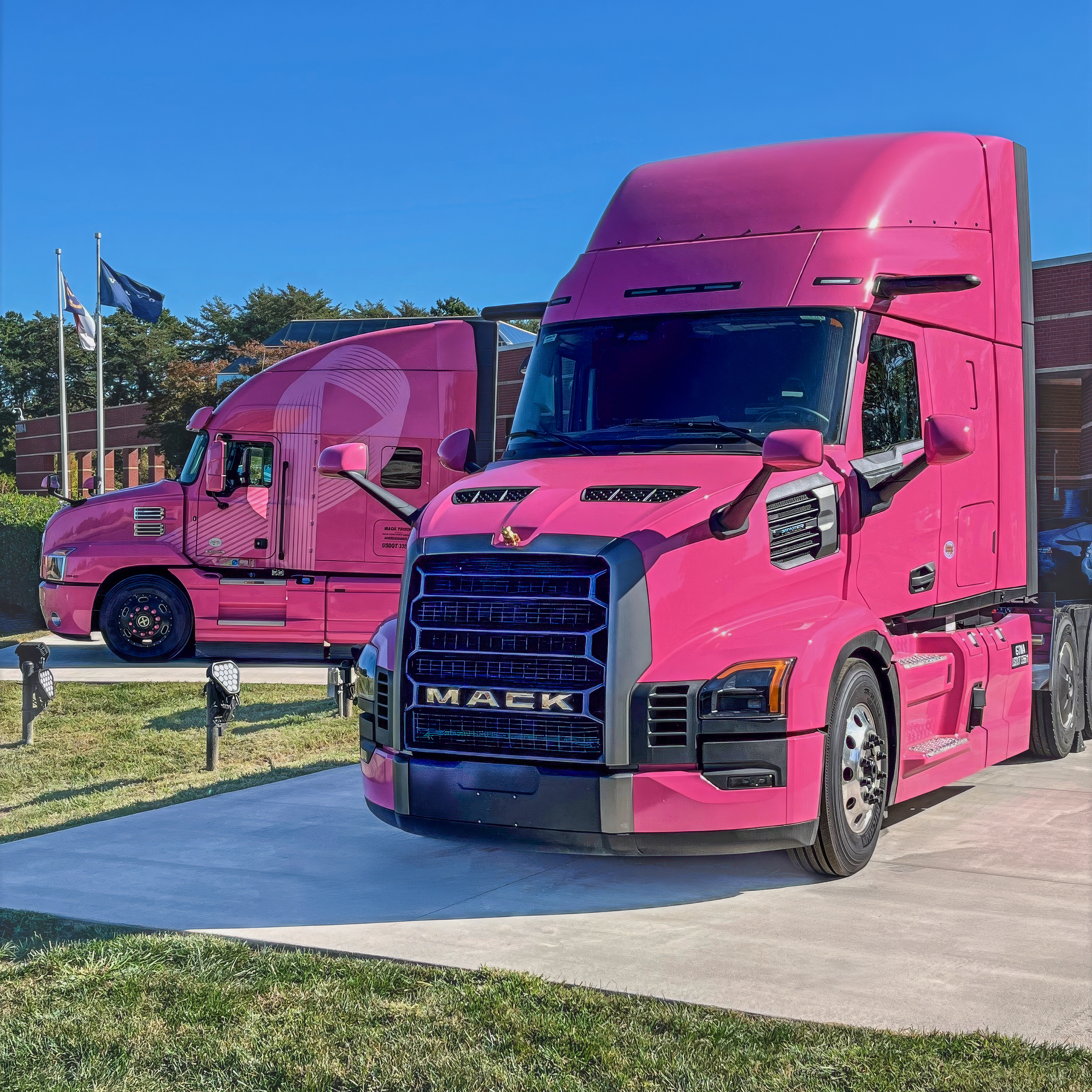 Mack Trucks' specially wrapped all-new Mack Pioneer (right) alongside the iconic &ldquo;Pink Lady&rdquo; Mack Anthem (left).