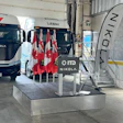 Nikola electric truck on display with Canadian flags at indoor event