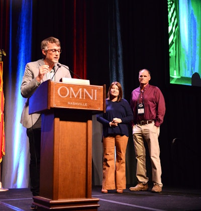 Dills, speaking from the stage and flanked by Robbie and Lori Turnage, finalists with their Tylertown, Mississippi-headquartered 29-truck fleet, Turnage & Sons, LLC.