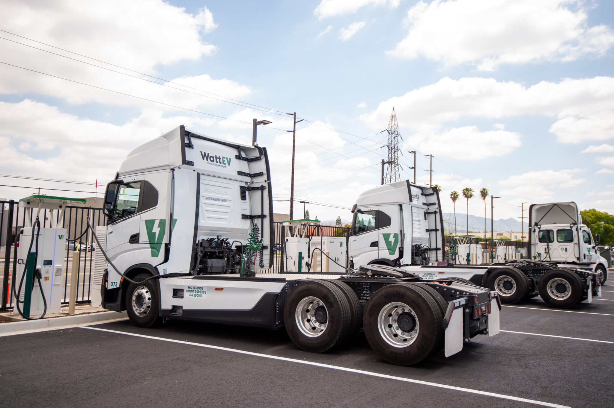 WattEV-branded battery-electric tractors are shown charging at the San Bernardino, Calif. depot, which produces nearly 700,000 kWh of energy monthly.