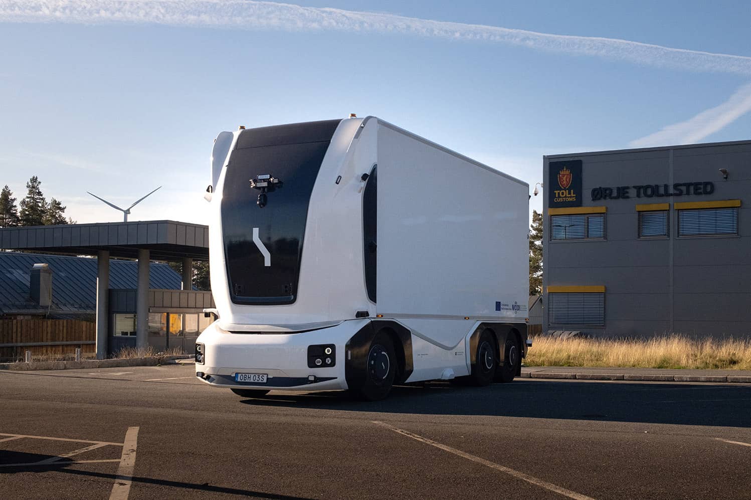 Einride's autonomous battery-electric delivery truck parked outside of the Orje customs office in Norway.