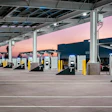 Electric vehicle charging station at sunset with multiple charging points