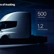 White Tesla Semi truck with performance specs in futuristic blue-toned warehouse