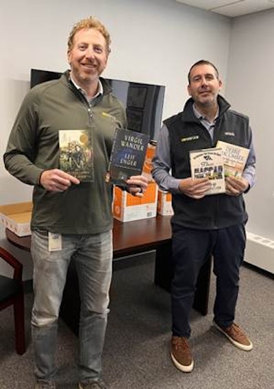 Helping pack up company donations at the Transervice headquarters office are Sean Schnipper (right), Director of Marketing, and Gregg Nierenberg, President & Chief Executive Officer.