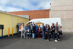 Port Power Founder and CEO Nadav Gur (second from left) poses Oakland Mayor Barbara Lee (center) with Family Laundry employees and city officials.