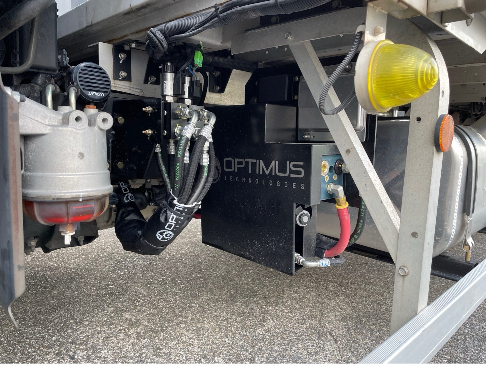 A detailed view of the Optimus Vector System manifold and fuel selector valves on a Hino truck, supporting 100% biodiesel operation in the Optimus&ndash;Mitsui partnership.