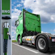 Green semi-truck refueling at RNG renewable natural gas station with cloudy sky