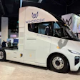 White Windrose all-electric semi-truck on display at a technology conference