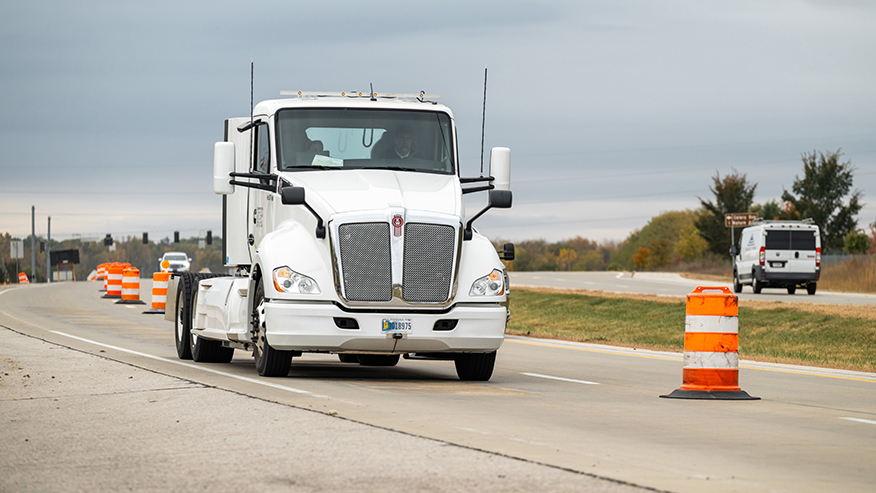 An electric heavy-duty truck provided by Cummins charges as it drives along a test segment on U.S. Highway 52/U.S. Highway 231 in West Lafayette, Indiana.