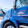 Blue NFI electric truck with zero emissions at shipping port
