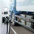 Electric truck charging station with power cables and battery modules