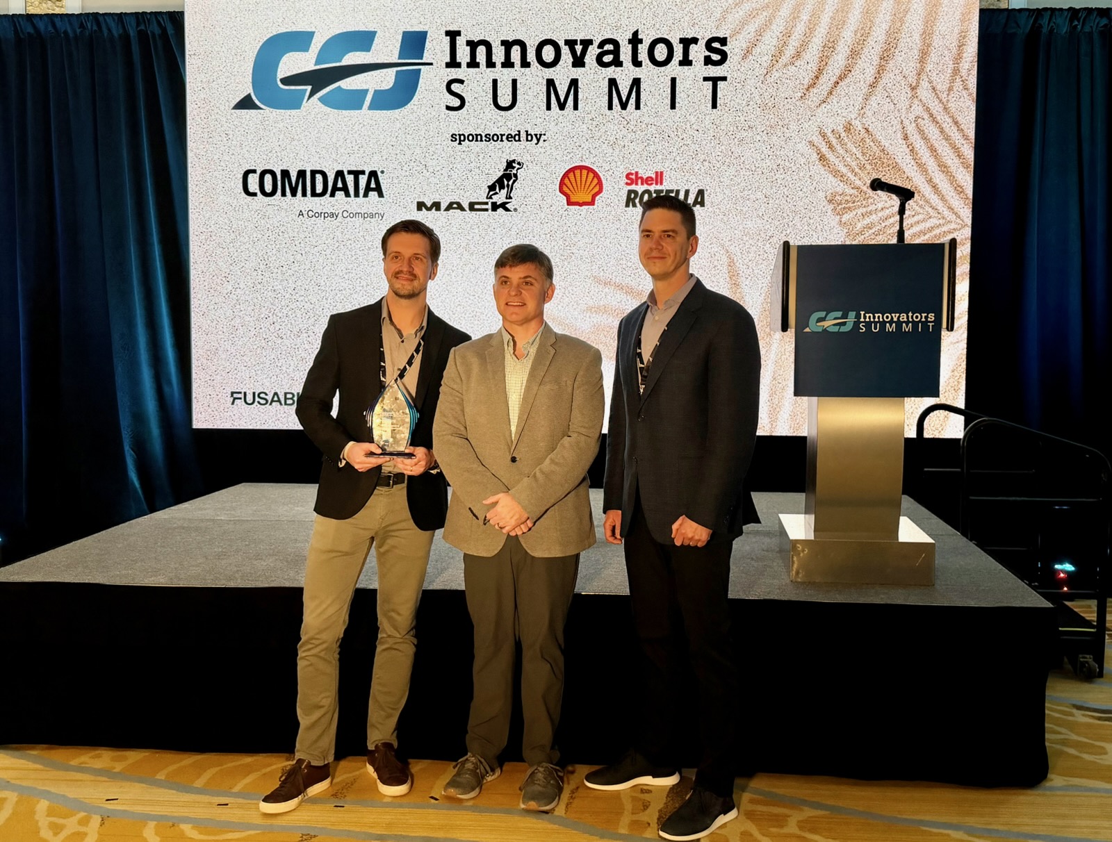 GP Transco upgraded its in-house TMS with two AI-powered tools to improve driver/load planning and reduce inefficiencies. Currently, 95% of load entries are automated through data robots and EDI, minimizing mismatched loads, reducing planner workload and boosting customer satisfaction. The company was named CCJ's Innovator of the Year Thursday night. Pictured are CEO Dominic Zastarskis and Amos Savickas, EVP of Operations.