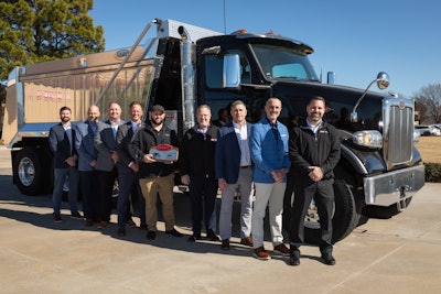 Pictured from left to right: Devin Stuck (Peterbilt) - Dealer Development Manager; Mike Devlin (Ohio Peterbilt) - Service Director; Adam Spinks (Peterbilt) - National Service Development Manager; Danny Landholm (Peterbilt) - Director of Dealer Network Development; Mike Fitzpatrick (Ohio Peterbilt) - Dealer Technical Manager and Peterbilt Master Technician; Ken Taylor (Ohio Peterbilt) – President; Mike Crawford (Ohio Peterbilt) - Vice President; Greg Rempe (Ohio Peterbilt) - Sales Director; and James Marshall (Ohio Peterbilt) - Parts Director.