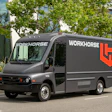 Workhorse branded electric delivery truck parked on street with landscaping background