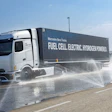 Mercedes-Benz hydrogen fuel cell truck spraying water during demonstration on wet pavement