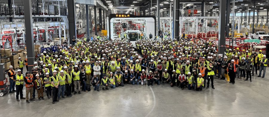Tesla Semi production line workers pose with the first completed Semi at Gigafactory Nevada.