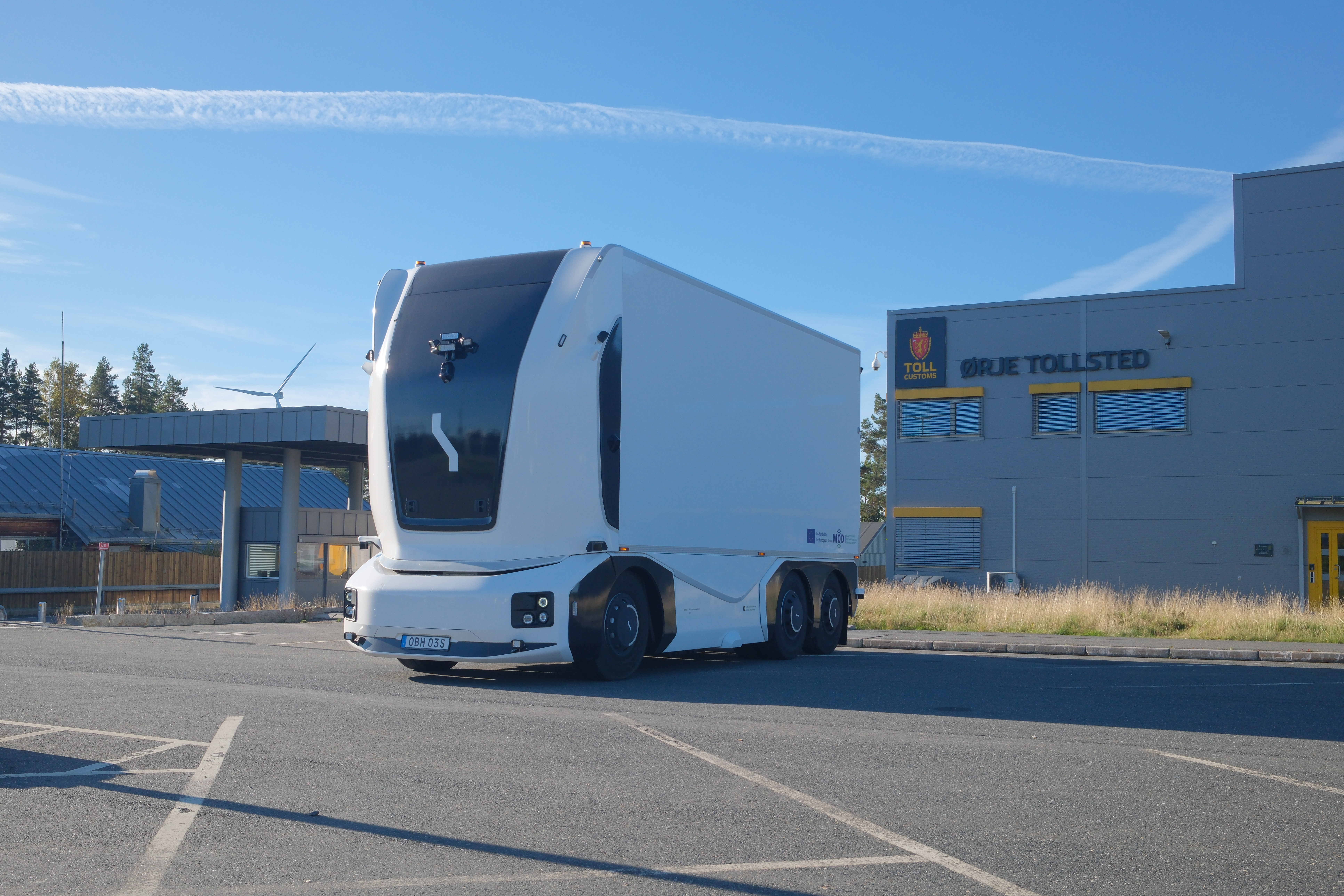 Einride's autonomous battery-electric delivery truck parked outside of the Orje customs office in Norway.