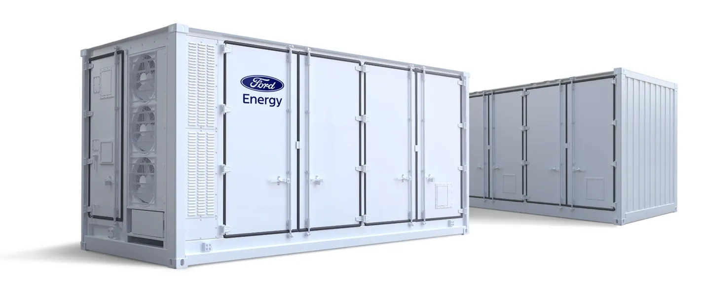 A display of Ford Energy battery storage containers and industrial power modules.