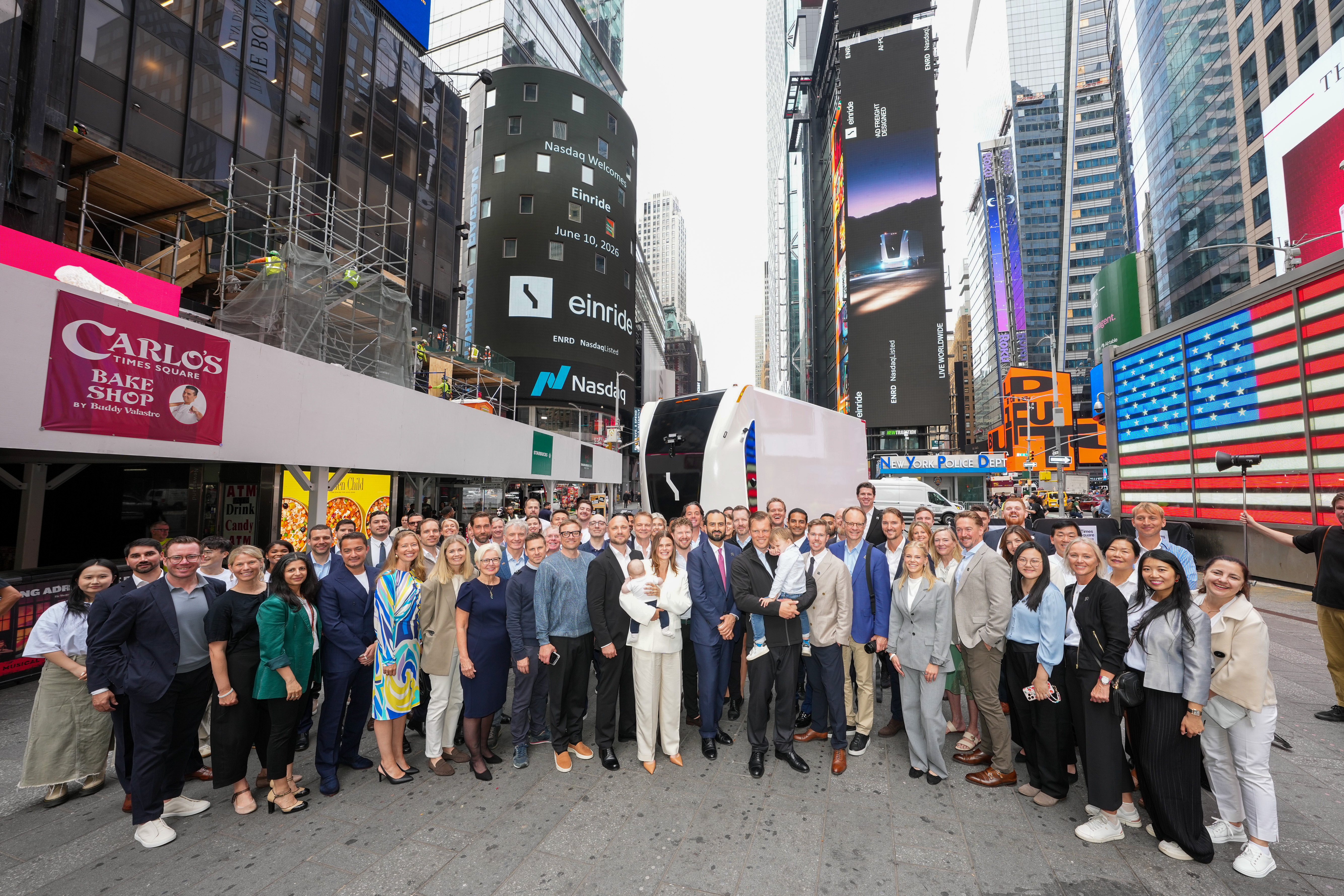 A large group of Einride employees gather in Times Square to celebrate the company's Nasdaq debut.
