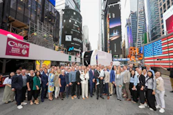 A large group of Einride employees gather in Times Square to celebrate the company's Nasdaq debut.
