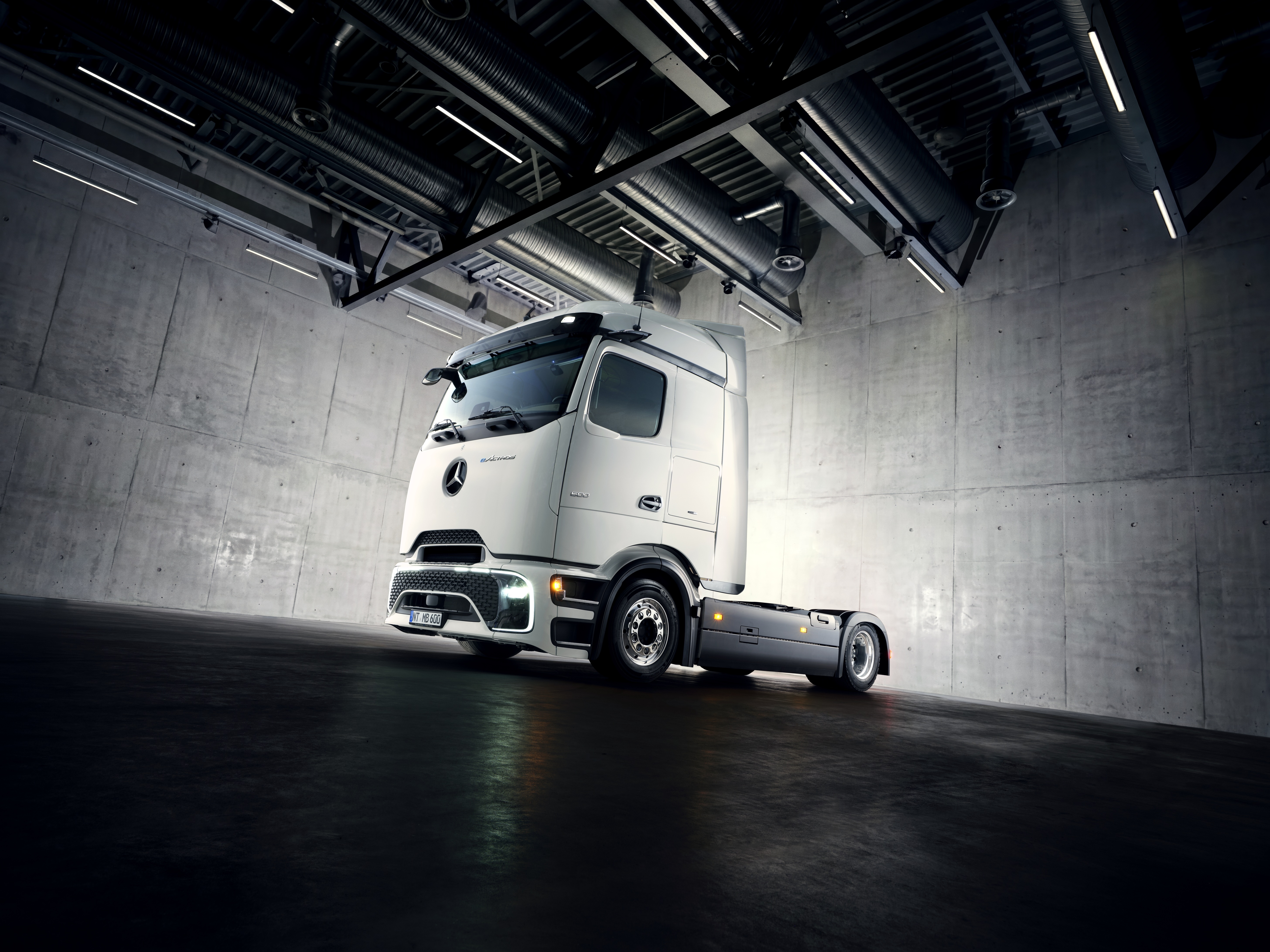 Mercedes-Benz eActros Lowliner showcased in a warehouse.