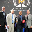 PGT Trucking inducted five new Million Mile Drivers for safe driving in 2025, including Christian Garcia, shown on stage with COO Chad Marsilio, President Gregg Troian and CEO Pat Gallagher.