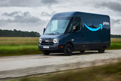 An Amazon Prime branded Rivian Electric Delivery Vehicle (EDV) driving a rural route in Europe.