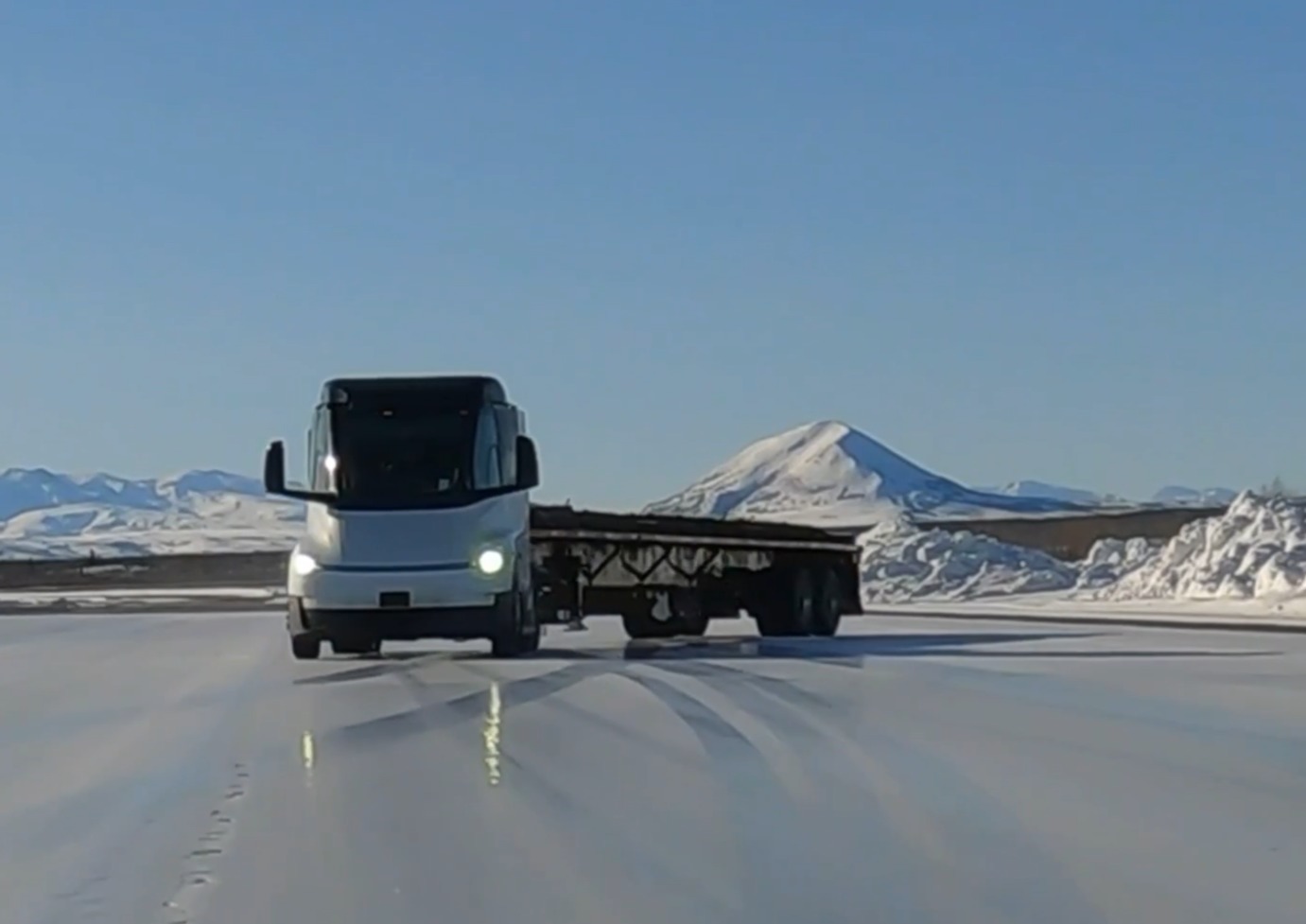 A Tesla Semi with a trailer demonstrates its Vehicle Dynamics Control system on an icy road surface.