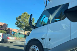 A white Tesla Semi equipped with self-driving hardware undergoing public road testing in California.