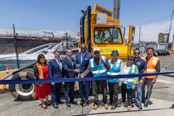 California State Transportation Agency (CalSTA) Secretary Toks Omishakin cutting a blue ribbon with state and port officials at the Port of Long Beach.