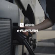 Person charging an electric vehicle with Einride and Flipturn brand logos displayed