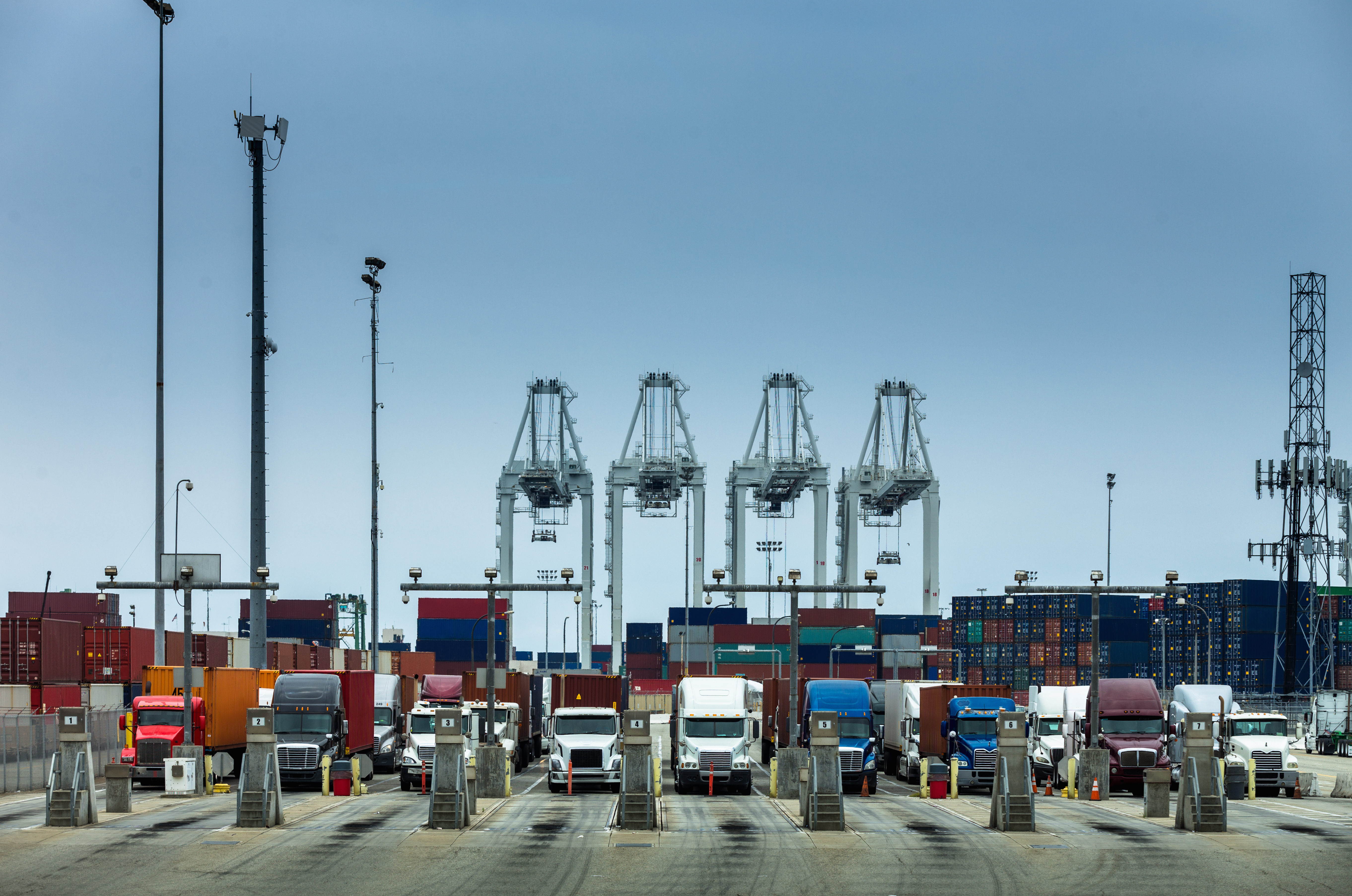 A row of Class 8 drayage semi-trucks at the Port of Los Angeles.