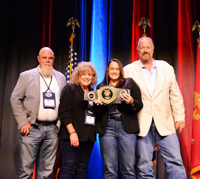 From right, TFX team Scott and Jana Denmark and Billie Jo and Scott Cruthis, victorious with the Overdrive's Small Fleet Champ title belt in the 11-30 trucks division last October. Enter to compete for 2026 by July 31.