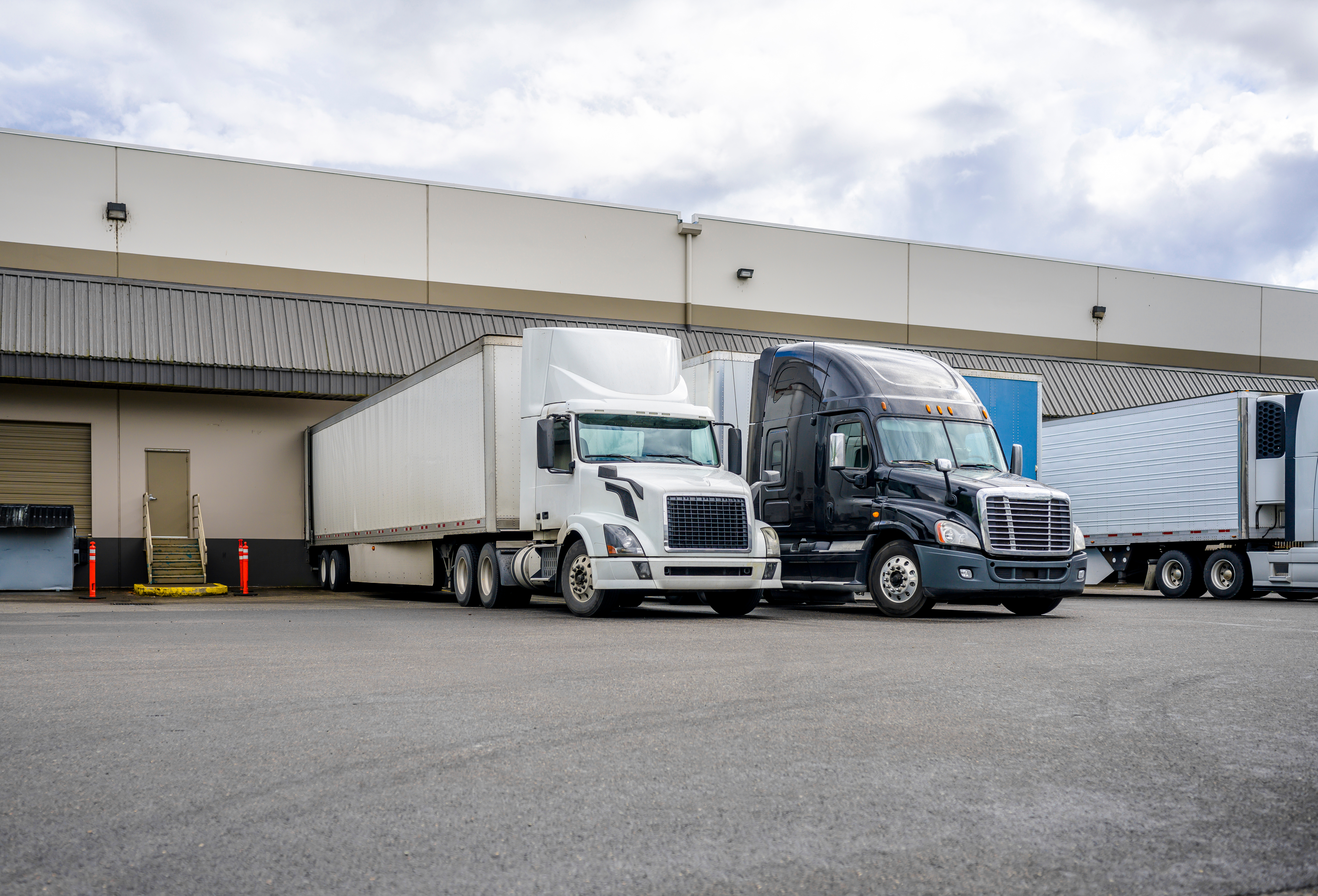 Trucks Dock Loading Unloading Adobe Stock 359838823