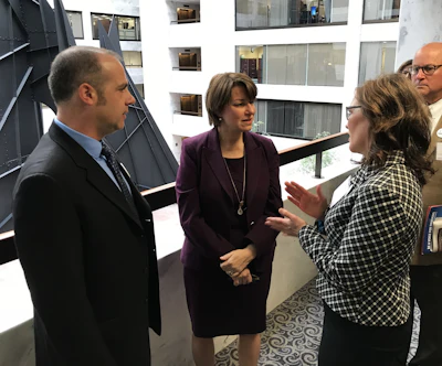 Kevin and Liz (right) in conversation with their Senator current state gubernatorial candidate, Amy Klobuchar, during a visit to the U.S. Capitol with MTA in past.