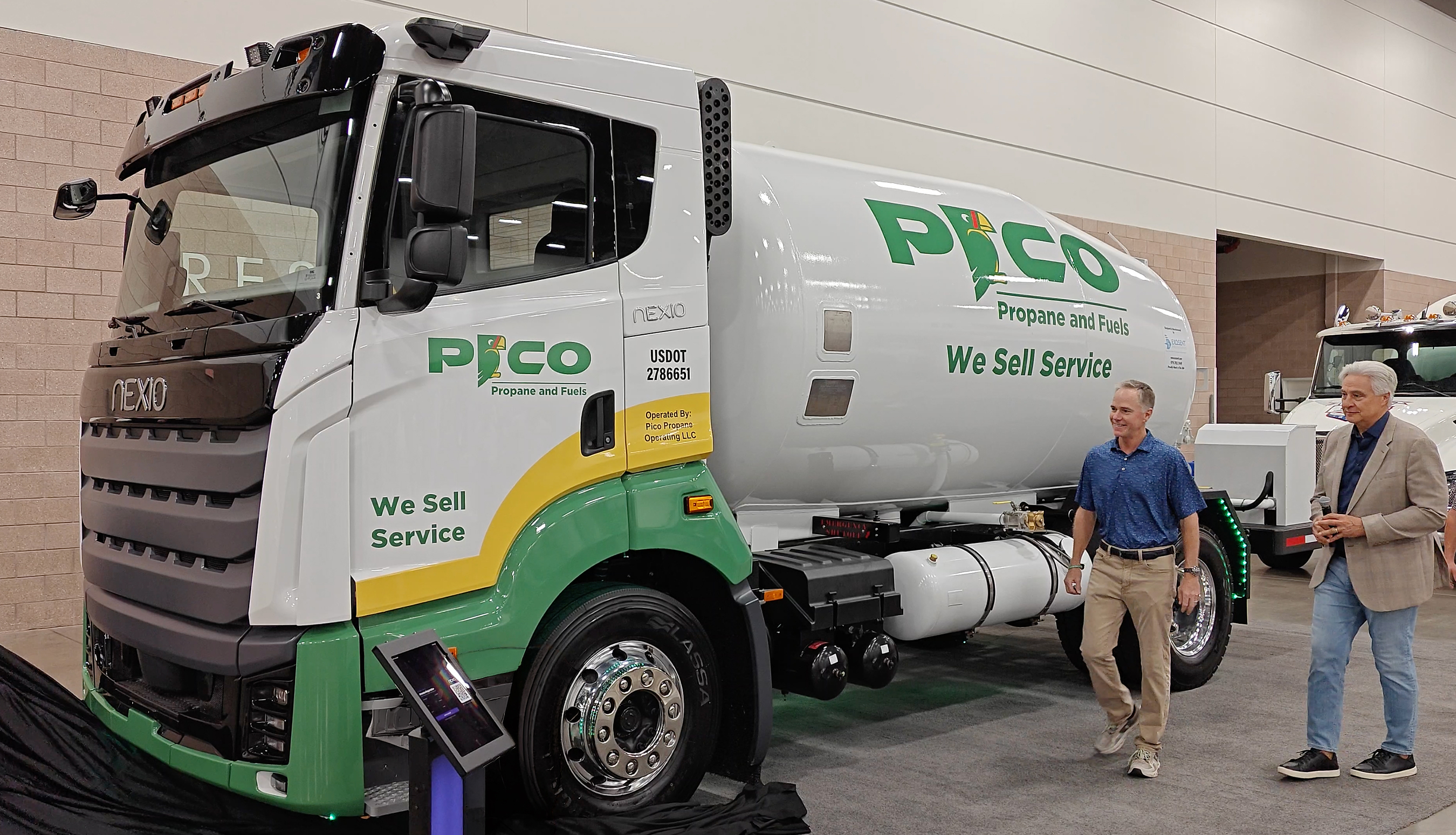 Nexio Power CEO Gary Winemaster, right, and Meritum Energy Holdings President and CEO Chris Hill, left, unveil the PICO Propane and Fuels demonstration truck at the 2026 Red River Crossroads Propane Expo in Irving, Texas, on Saturday, August 8.