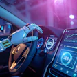 Robotic hand steering futuristic autonomous vehicle with illuminated digital dashboard displaying performance metrics