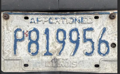 Vintage Illinois apportioned license plate numbered P819956 with blue text on white background