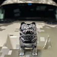 Chrome Mack Trucks bulldog hood ornament mounted on white truck hood