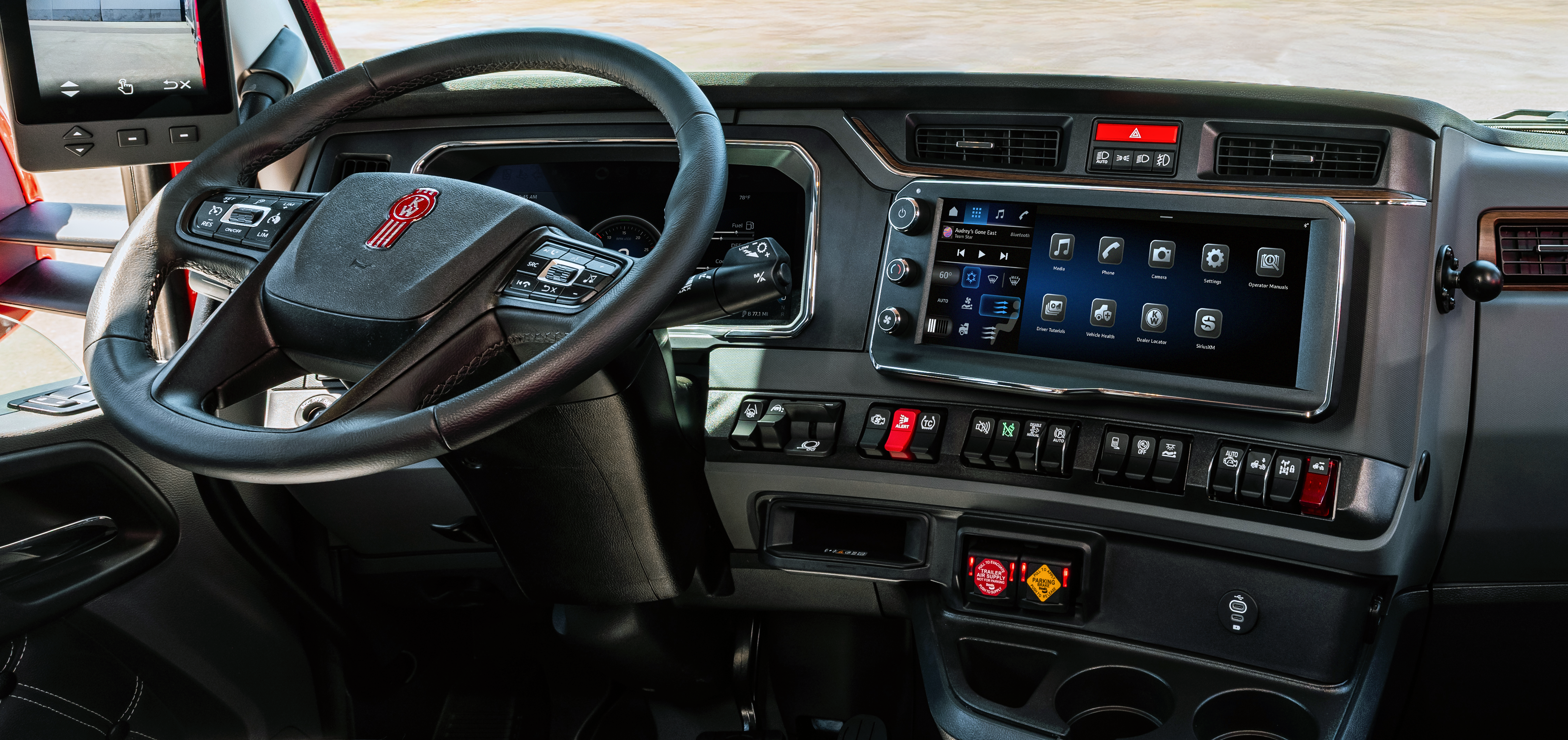 GMC truck dashboard interior with steering wheel, digital display, and control panels
