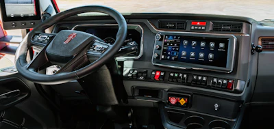 GMC truck dashboard interior with steering wheel, digital display, and control panels